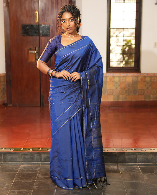Navy Blue Vasundhara Lite Silk Saree, Subtly Sparkled with Paisa Zari Buttas Across Its Body, Highlighted Zari Border of Horizontal Stripes, Gleaming Pallu of Seppu Rekku Designs, and Paired with a Matching Blouse