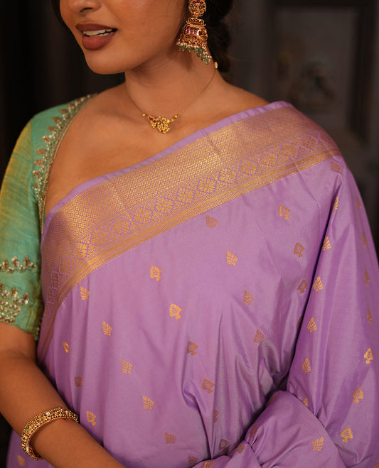 Lavender Gift Saree, Elevated with Zari Buttas All Over Its Body, Highlighted by a Traditional Zari Design Border, Grand Pallu of Jaal Designs, and Paired with a Matching Blouse