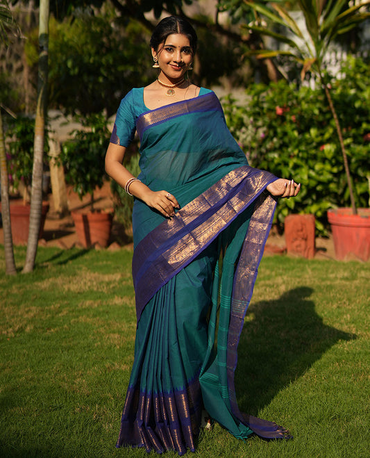 Blue Plain Chettinad Cotton Saree, Complemented by a Contrast Rettai Pettu, Traditional Zari Temple Border of Peacock and Elephant Designs, Subtly Striped Pallu, and Paired with a Matching Blouse