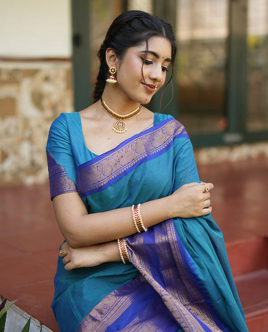 Blue Plain Chettinad Cotton Saree, Complemented by a Contrast Rettai Pettu, Traditional Zari Temple Border of Peacock and Elephant Designs, Subtly Striped Pallu, and Paired with a Matching Blouse