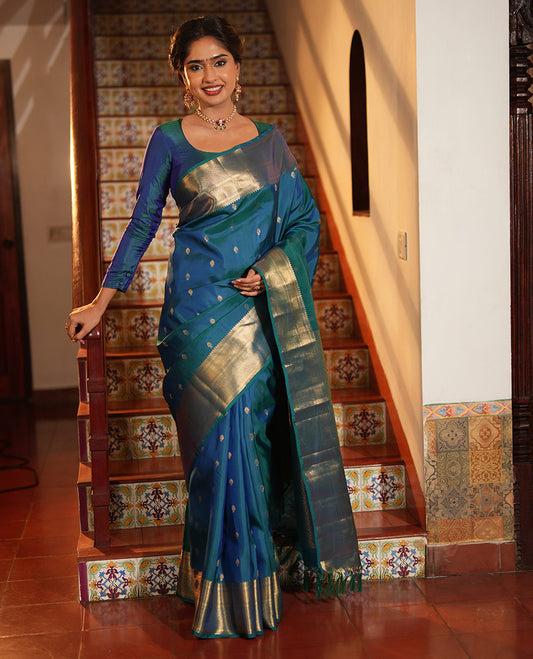 Blue Vasundhara Lite Silk Mix Saree, Enriched with Zari Buttas All Over Its Body, Highlighted by a Zari Border of Traditional Zari Designs, Grandly Zari Decked Up Pallu, and Paired with a Matching Blouse