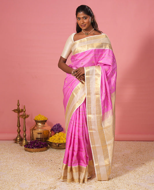 Candy pink zari design silk saree, contrast zari border of diamond designs, and zari-rich jaal pallu