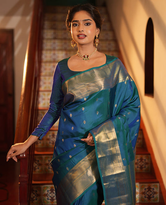Blue Vasundhara Lite Silk Mix Saree, Enriched with Zari Buttas All Over Its Body, Highlighted by a Zari Border of Traditional Zari Designs, Grandly Zari Decked Up Pallu, and Paired with a Matching Blouse