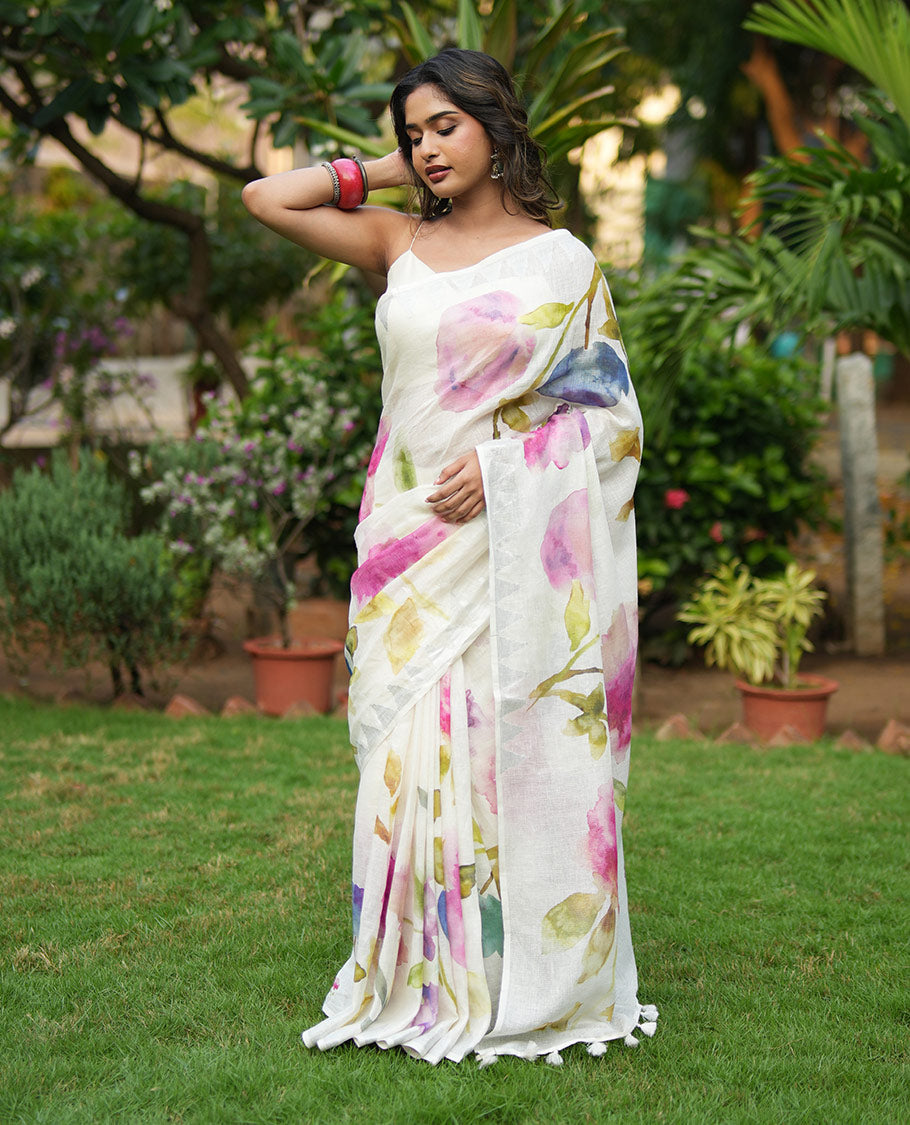 Cream-Base Linen Saree, Highlighted by Floral-Themed Paint Splashes, Hand-Brush Painted All Over Its Body, Sparsely Woven Temple Border, and Paired with a Matching Blouse