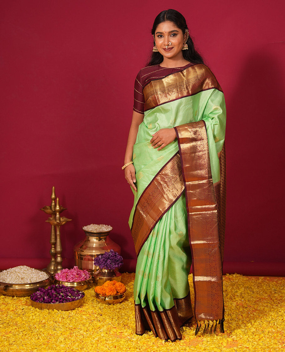 Green zari striped and mayil buttas silk saree, contrast zari border of diamond, muthu, and mayil designs, and jaal pallu