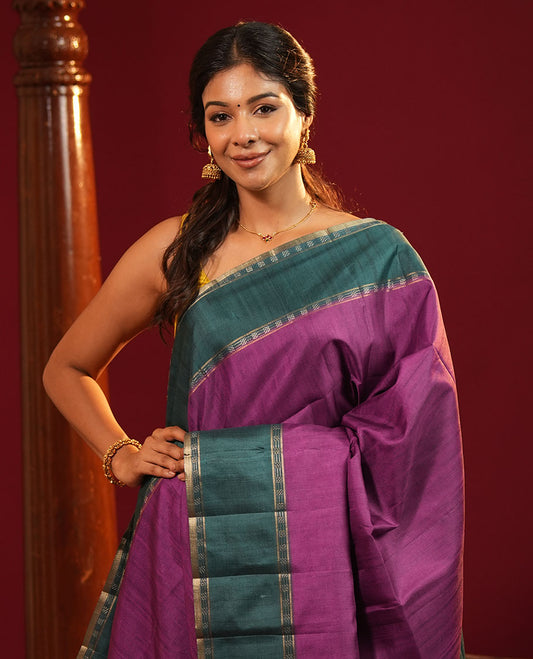 Purple Plain Semi-Tussar Silk Saree, Complemented by a Contrast Geometric Design Border, Subtly Zari Striped Pallu, and Paired with a Contrast Patola Printed Blouse