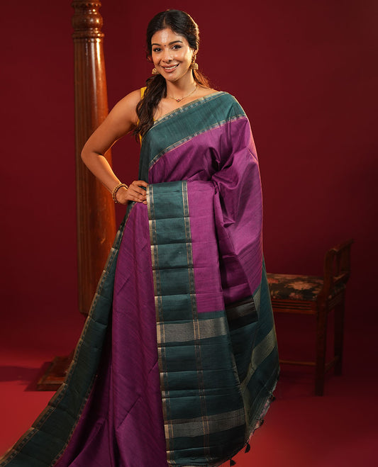 Purple Plain Semi-Tussar Silk Saree, Complemented by a Contrast Geometric Design Border, Subtly Zari Striped Pallu, and Paired with a Contrast Patola Printed Blouse