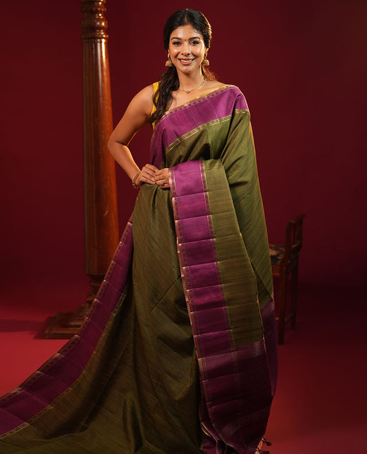 Mehendi Green Plain Semi-Tussar Silk Saree, Complemented by a Contrast Geometric Design Border, Subtly Zari Striped Pallu, and Paired with a Contrast Patola Printed Blouse