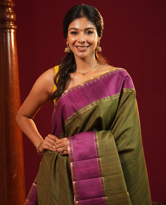 Mehendi Green Plain Semi-Tussar Silk Saree, Complemented by a Contrast Geometric Design Border, Subtly Zari Striped Pallu, and Paired with a Contrast Patola Printed Blouse