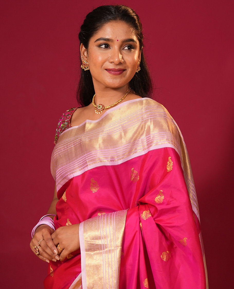 Rani pink zari buttas silk saree, contrast border of muthu, diamond, kathir, and mayil kann designs, and jaal pallu