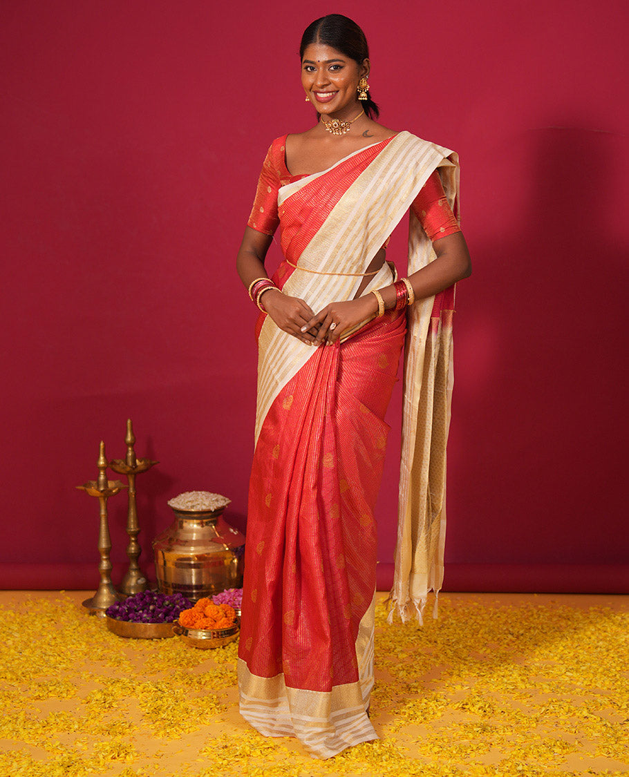 Orange muthu kattam and zari buttas silk saree, contrast varisai pettu border of thilakam, muthu, and rudraksham designs, and jaal pallu