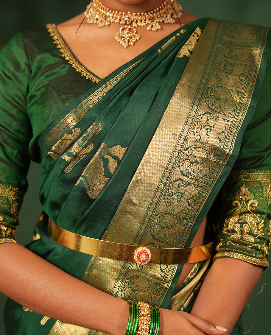 Green singam and yaanai zari buttas woven silk saree, zari border of mayil kann, rudraksham, muthu, mayil, and yaali designs, and intricate pallu
