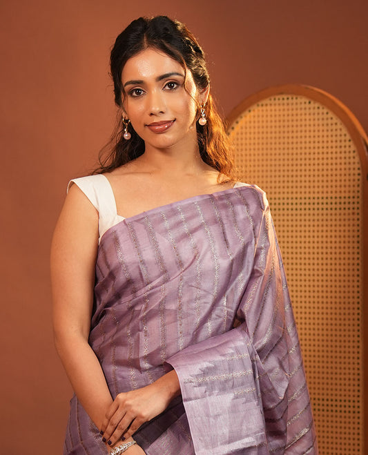 Borderless Lavender Tussar Silk Saree, Adorned With Zari Stripes All Over Its Body, Highlighted by Self-Pallu and Paired with a Matching Blouse