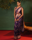 Purple Vasundhara Silk Saree, Accentuated with Floral Jaal Jacquard, Complemented by Zari Border of Thilakam Mokku, Lavangam, and Jaal Designs, Grandly Woven Pallu, and Paired with a Matching Blouse