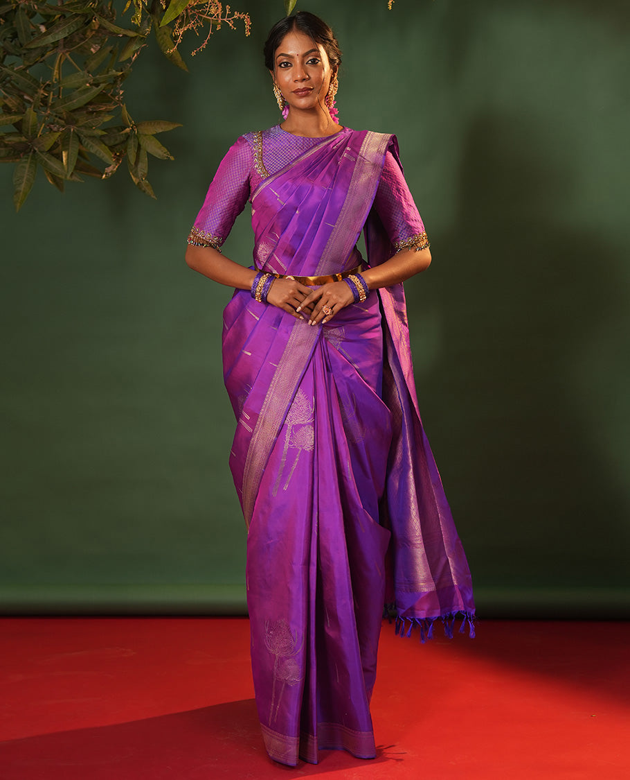 Violet Vasundhara Silk Saree Accentuated with Thazampoo Rekku, and Vel Buttas, Complemented by Zari Border of Manga, Muthu, Kathir, Neli, and Vanki Designs, Pallu Adorned with Jaal Designs, and Paired with a Matching Blouse