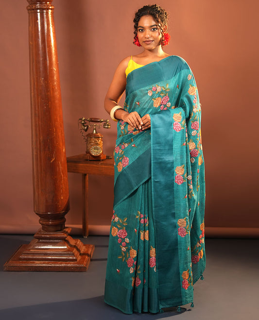 Rama Blue Green-Silk Saree, Colorfully Highlighted with Rose Motifs Cross Stitch Embroidery on Its Body, Subtly Sparkled by a Plain Border, Pallu of Rose Cross Stitch Embroidery, and Paired with a Contrast Blouse