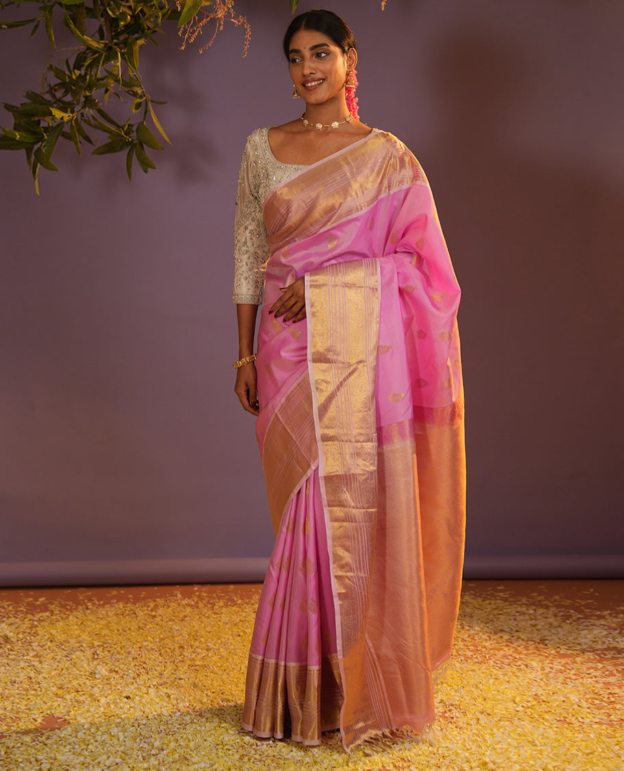 Pink mayil buttas Vasundhara silk saree, zari border of muthu, diamond, mayil kann, kamalam, and mayil designs, and intricate pallu