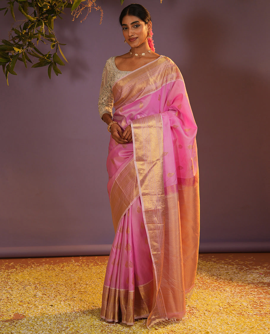 Pink mayil buttas Vasundhara silk saree, zari border of muthu, diamond, mayil kann, kamalam, and mayil designs, and intricate pallu