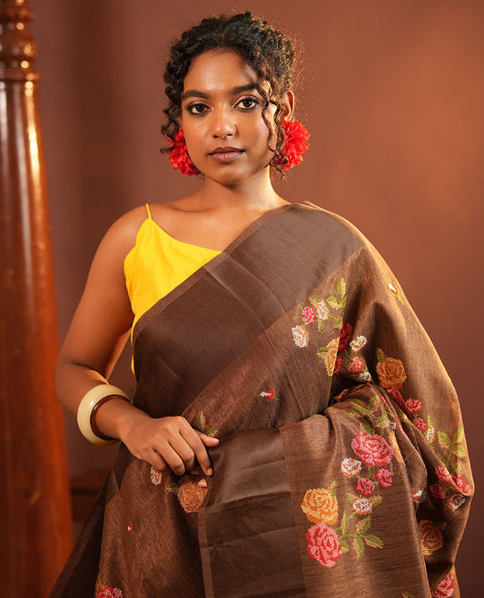 Brown Green-Silk Saree, Colorfully Highlighted with Rose Motifs Cross Stitch Embroidery on Its Body, Subtly Sparkled by a Plain Border, Pallu of Rose Cross Stitch Embroidery, and Paired with a Contrast Blouse