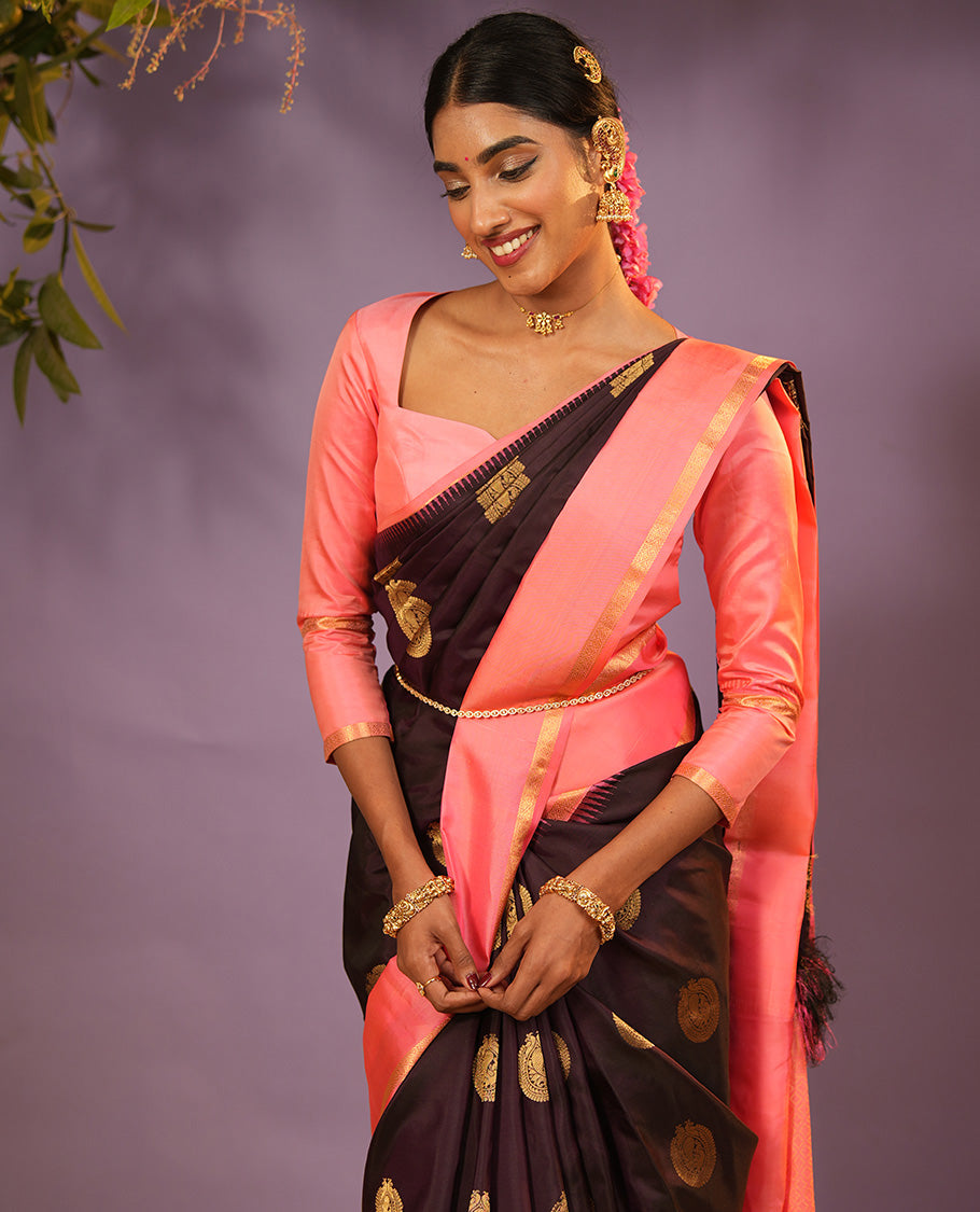 Coffee Brown Vasundhara Silk Saree Accentuated with Round Mayil Buttas, Complemented with Contrast Rettai Pettu Thazampoo Rekku Zari Border, Beautifully Woven Pallu of Jaal Design, and Paired with a Contrast Blouse