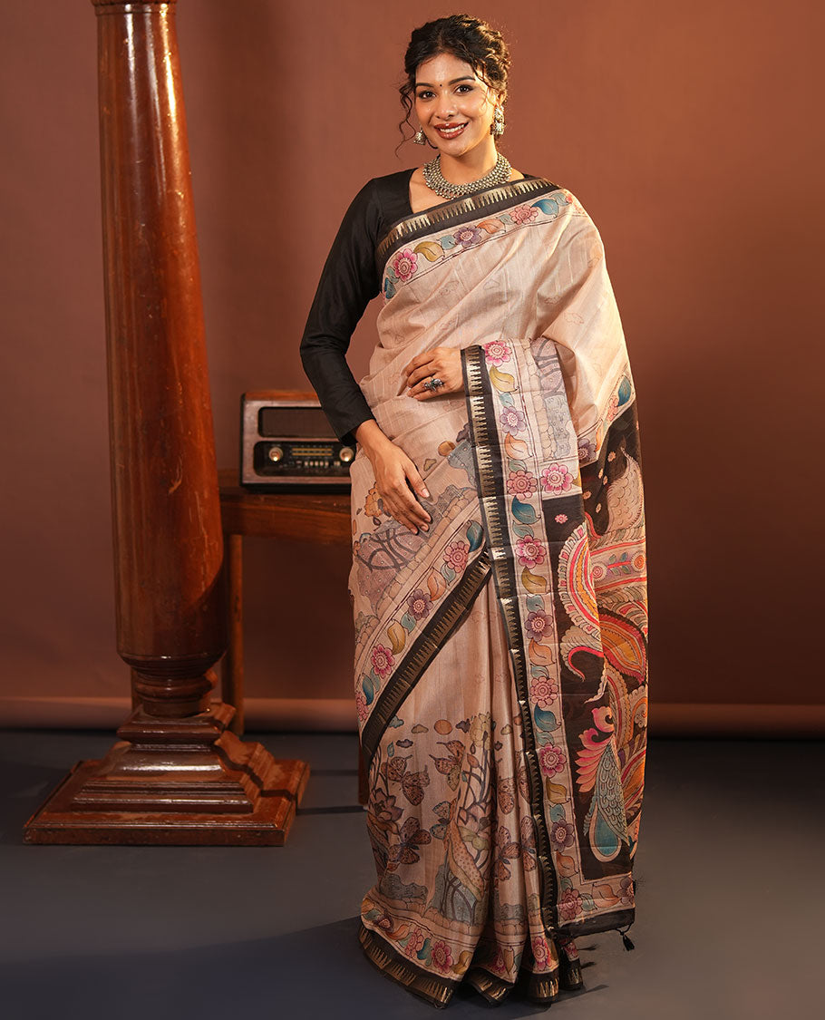 Chikku-Black Fancy Tussar Saree, Artfully Detailed with Kalamkari-Style Floral Print Across Its Body, Complemented by Contrast Temple Zari Border, a Colourfully Kalamkari Printed Pallu, and Paired with a Plain Blouse