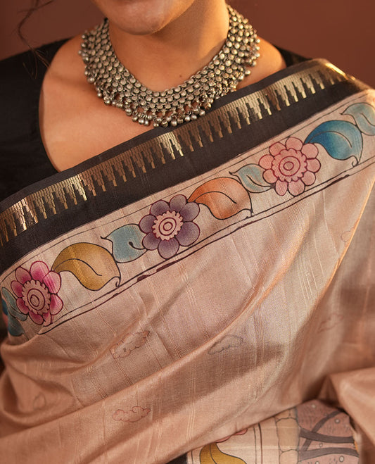 Chikku-Black Fancy Tussar Saree, Artfully Detailed with Kalamkari-Style Floral Print Across Its Body, Complemented by Contrast Temple Zari Border, a Colourfully Kalamkari Printed Pallu, and Paired with a Plain Blouse