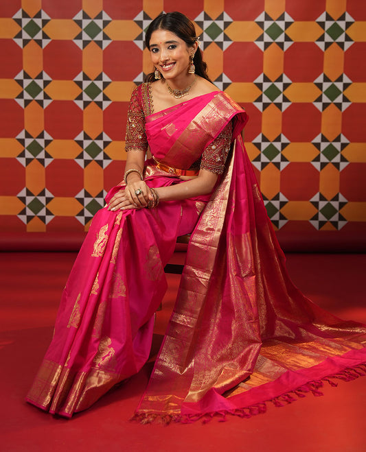 Pink singam and yaanai zari buttas woven silk saree, zari border of mayil kann, rudraksham, muthu, mayil, and yaali designs, and intricate pallu