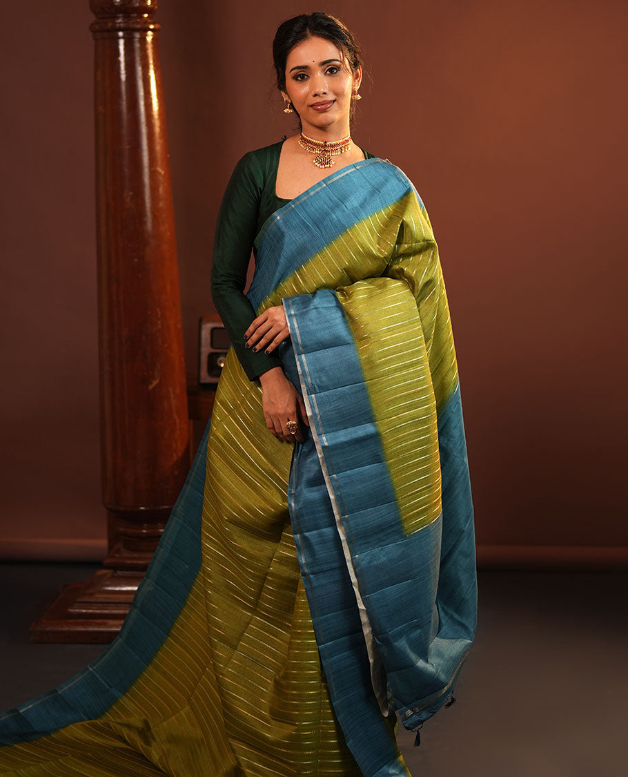 Pista Green Fancy Tussar Saree, Highlighted by Vertical Zari Stripes Across Its Body, Complemented by Captivating Contrast Geometric Patterned Border, Subtle Pallu and Paired with a Contrast Blouse
