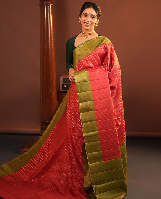 Rust Fancy Tussar Saree, Highlighted by Vertical Zari Stripes Across Its Body, Complemented by Captivating Contrast Geometric Patterned Border, Subtle Pallu and Paired with a Contrast Blouse