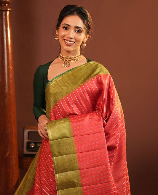 Rust Fancy Tussar Saree, Highlighted by Vertical Zari Stripes Across Its Body, Complemented by Captivating Contrast Geometric Patterned Border, Subtle Pallu and Paired with a Contrast Blouse