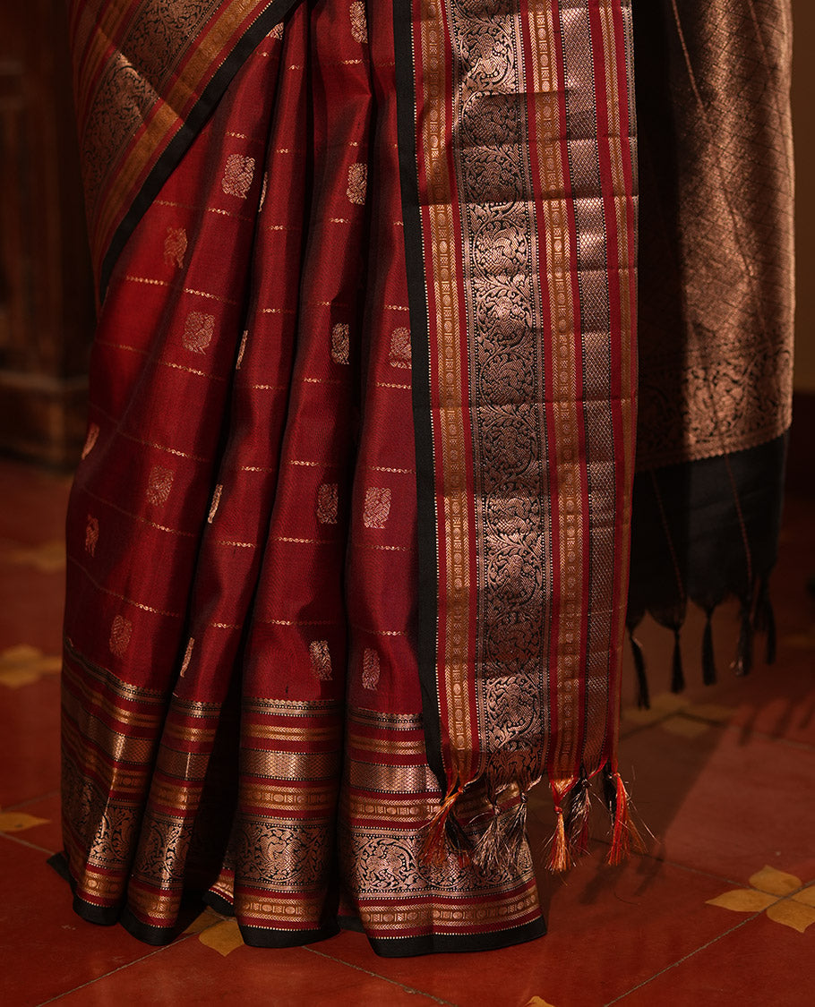 Maroon Striped-Mayil Buttas Vasundhara Silksaree, Contrast Border of Mayil Kann,Mayil, and Yaali, Jaal Pallu, and a Contrast Blouse
