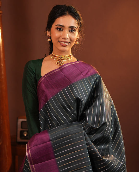 Grey Fancy Tussar Saree, Highlighted by Vertical Zari Stripes Across Its Body, Complemented by Captivating Contrast Geometric Patterned Border, Subtle Pallu and Paired with a Contrast Blouse