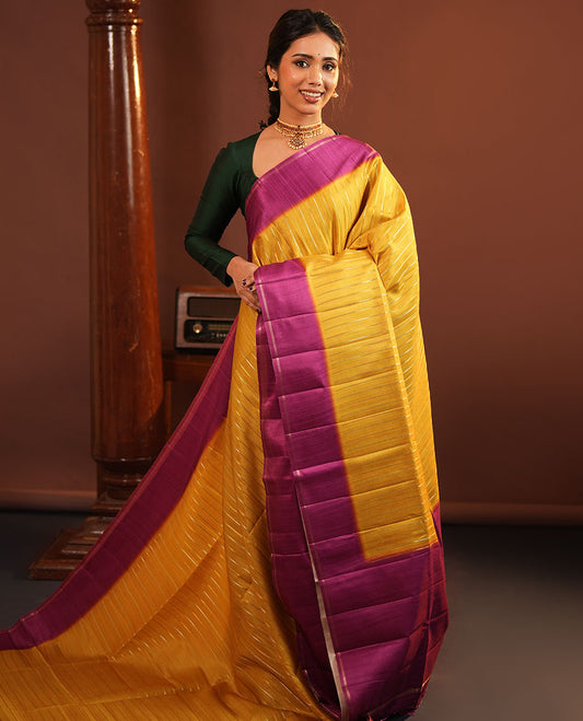 Mustard Fancy Tussar Saree, Highlighted by Vertical Zari Stripes Across Its Body, Complemented by Captivating Contrast Geometric Patterned Border, Subtle Pallu and Paired with a Contrast Blouse