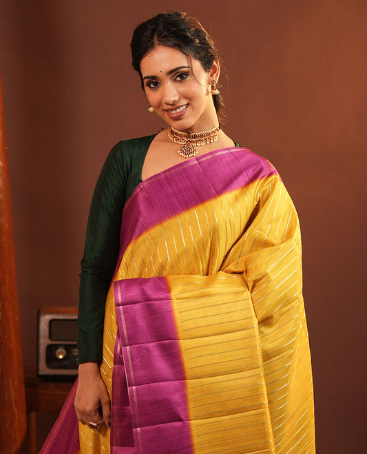 Mustard Fancy Tussar Saree, Highlighted by Vertical Zari Stripes Across Its Body, Complemented by Captivating Contrast Geometric Patterned Border, Subtle Pallu and Paired with a Contrast Blouse