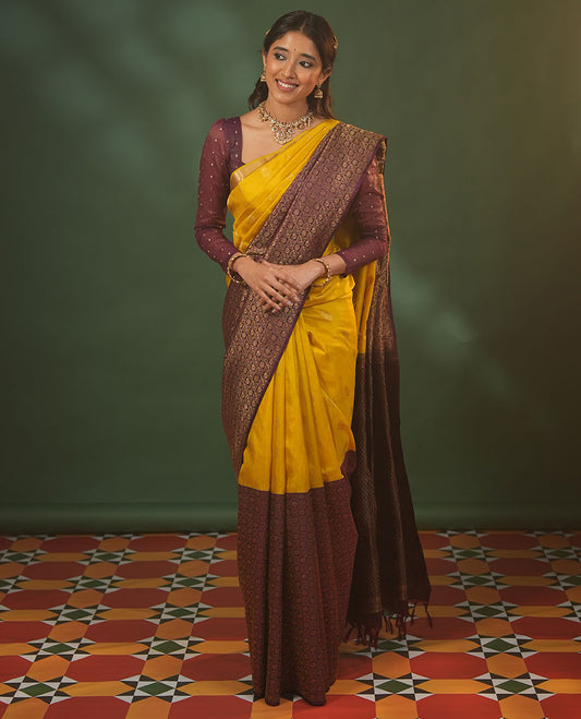 Yellow floral zari buttas woven skrit-border-style woven silk saree, contrast annam chakram butta enclosed checked border, and zari-rich jaal pallu