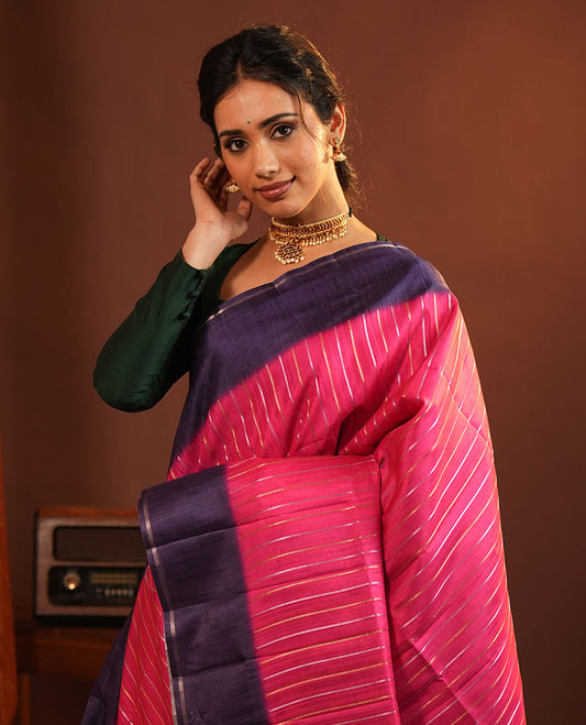 Pink Fancy Tussar Saree, Highlighted by Vertical Zari Stripes Across Its Body, Complemented by Captivating Contrast Geometric Patterned Border, Subtle Pallu and Paired with a Contrast Blouse
