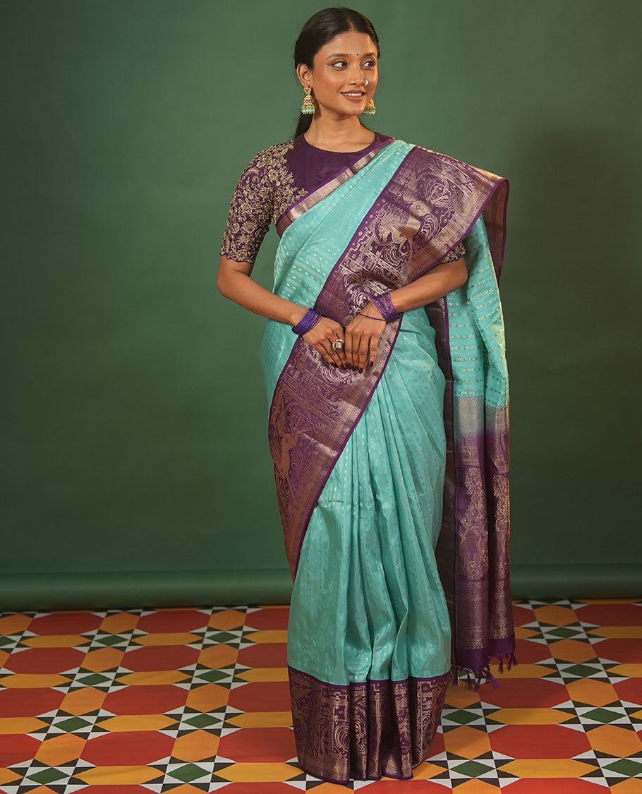Blue Vasundhara Silk Saree Delicately Woven with Varai Oosai and Rudraksham Buttas, Captivating Contrast Kuthirai Motifs Zari Woven Border, Intricately Designed Pallu, and Paired with a Contrast Blouse