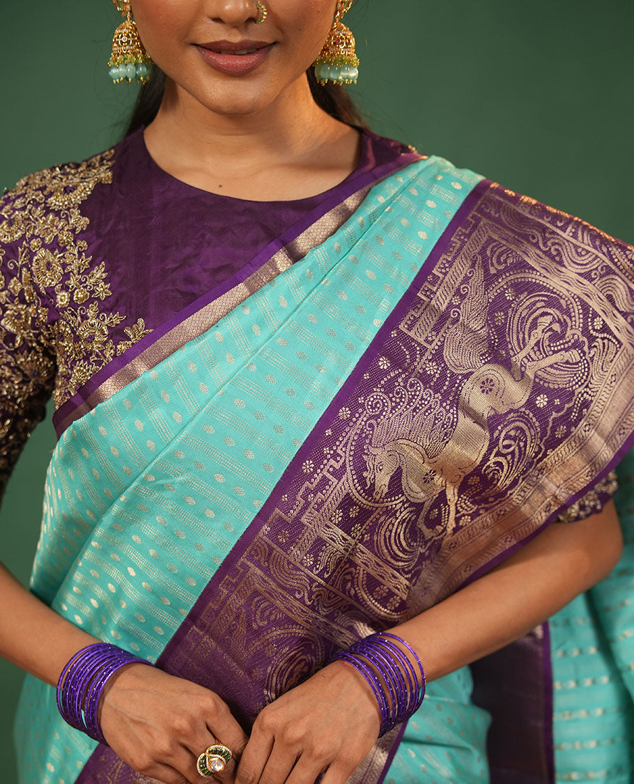 Blue Vasundhara Silk Saree Delicately Woven with Varai Oosai and Rudraksham Buttas, Captivating Contrast Kuthirai Motifs Zari Woven Border, Intricately Designed Pallu, and Paired with a Contrast Blouse