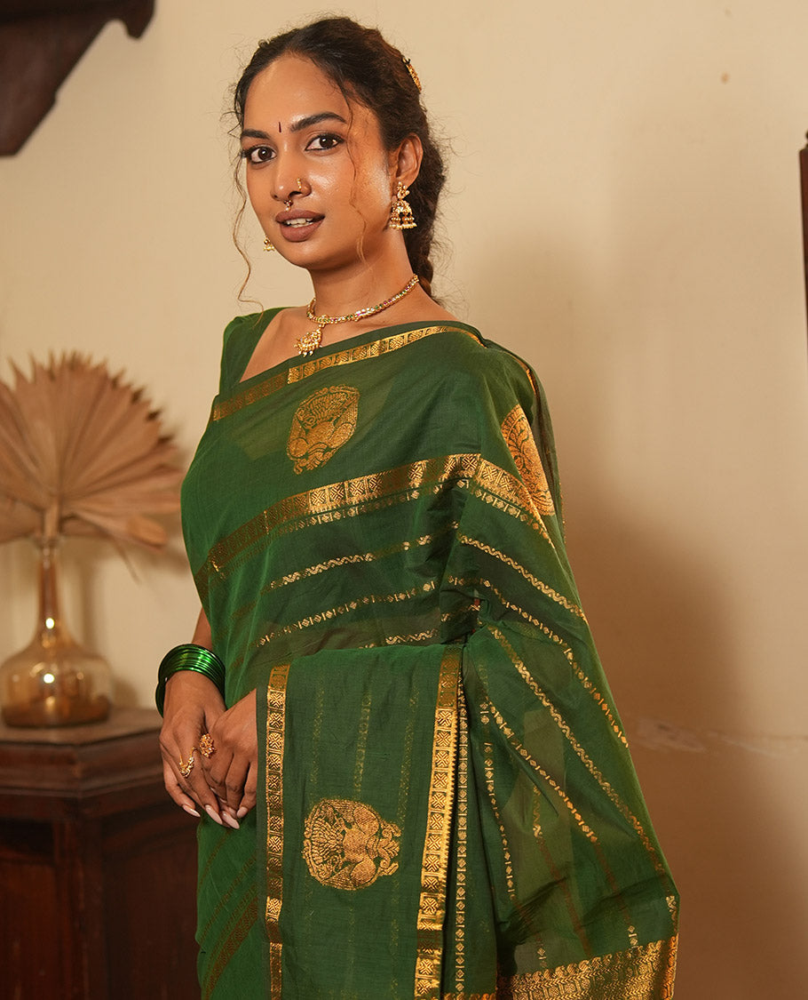 Green Chettinad Cotton Saree, Decorated with Zari Stripes, a Zari Iruthalai Pakshi-Yaali Border, Grand Pallu, and a Matching Blouse