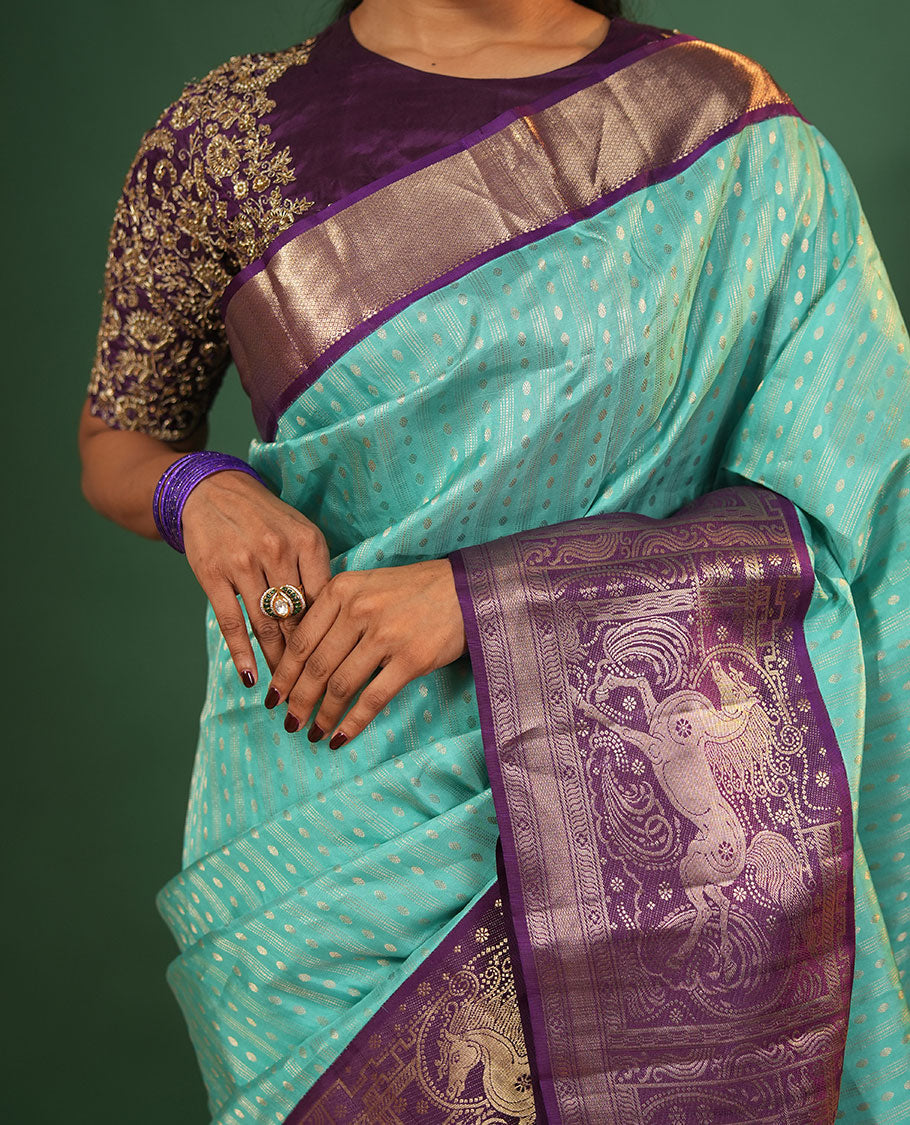 Blue Vasundhara Silk Saree Delicately Woven with Varai Oosai and Rudraksham Buttas, Captivating Contrast Kuthirai Motifs Zari Woven Border, Intricately Designed Pallu, and Paired with a Contrast Blouse