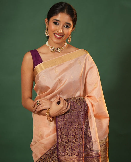 Peach floral zari buttas woven skrit-border-style woven silk saree, contrast annam chakram butta enclosed checked border, and zari-rich jaal pallu