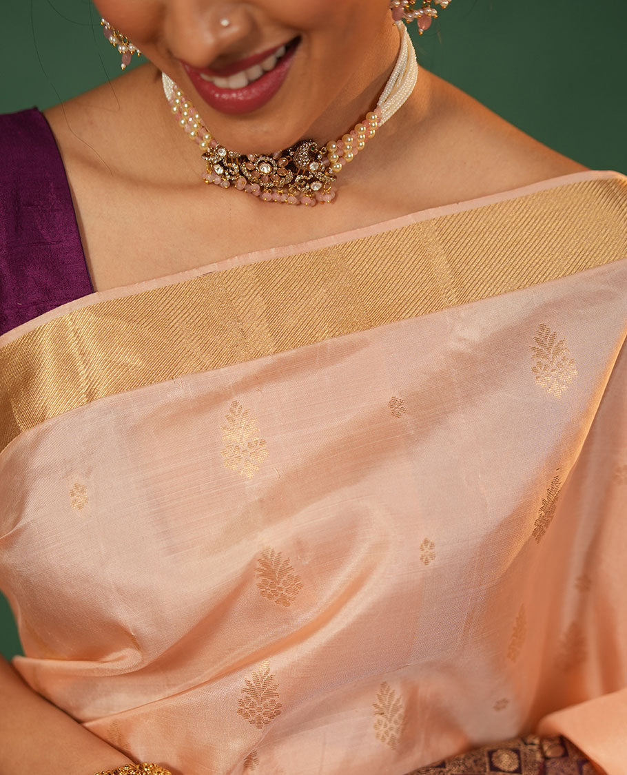 Peach Vasundhara Silk Saree Featuring Floral Zari Buttas and Skrit-Border-Style Contrast Annam Chakram Butta Enclosed Checked Border, Majestically Zari Detailed Pallu, and Paired with a Contrast Blouse