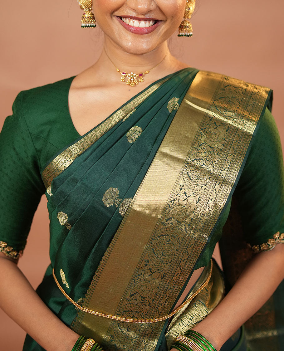 Green zari buttas and mamallapuram temple motifs zari woven silk saree, zari border of salangi, muthu, banaras, mayil, and lavangam designs, and intricate pallu