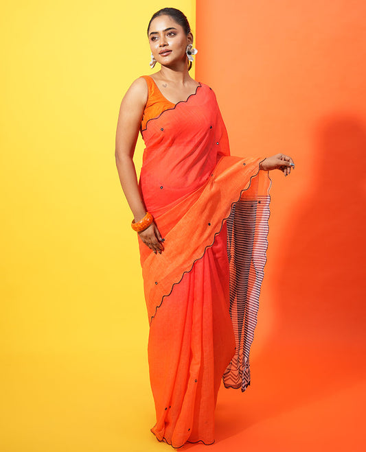Red-Orange Linen Cotton Saree, Bedecked with Ombre-Style Dyed with Mirror Work Across Its Body, Subtly Sparkled Scallop Thread Border, Pallu Steeped with Stripes and Mirror Work, and Paired with a Contrast Vertical Stripes Printed Blouse