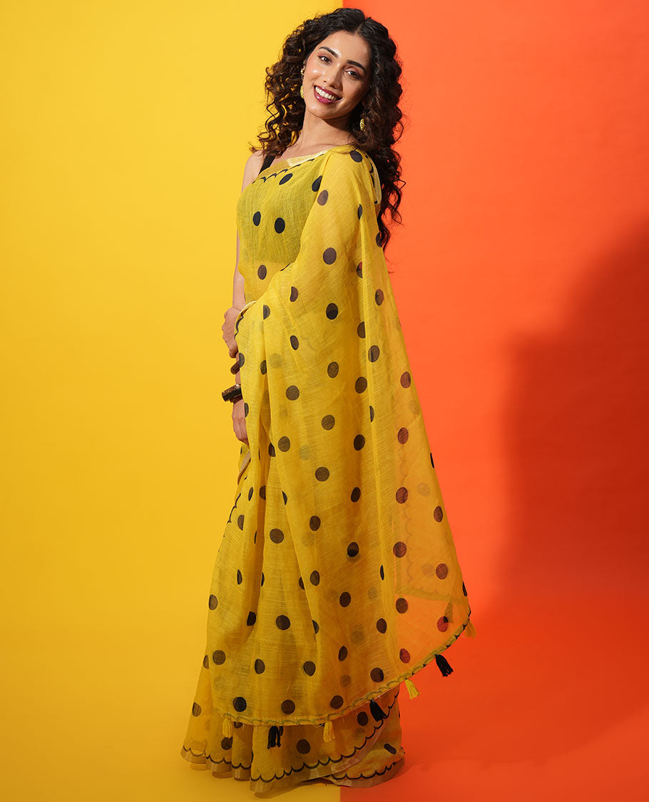 Yellow Linen Cotton Saree, Beautified with Polka Dots All Over Its Body, Subtle Piping Border, Self-Pallu, and Paired with a Floral Printed Matching Blouse