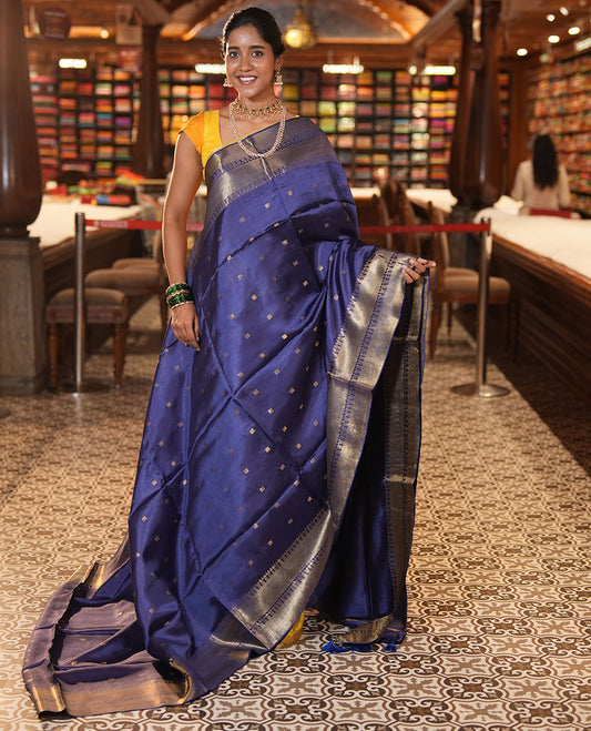Blue Banana Pith Saree, Enriched with Zari Buttas, a Traditional Zari Border, Zari Striped Pallu, a Matching Blouse