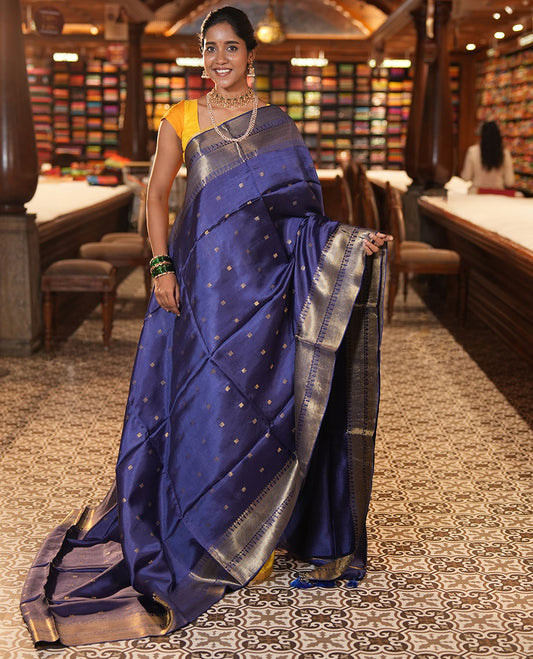Blue Banana Pith Saree, Enriched with Zari Buttas, a Traditional Zari Border, Zari Striped Pallu, a Matching Blouse