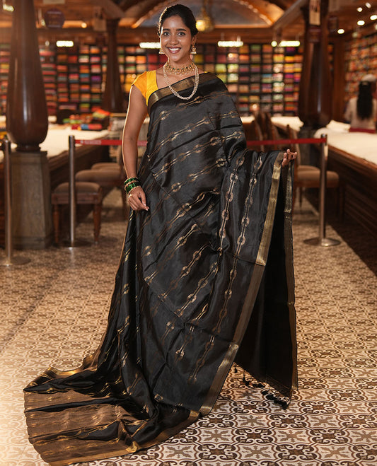 Black Banana Pith Saree, Elevated with Zari Stripes, a Zari Border, Zari Woven Pallu, and a Matching Blouse