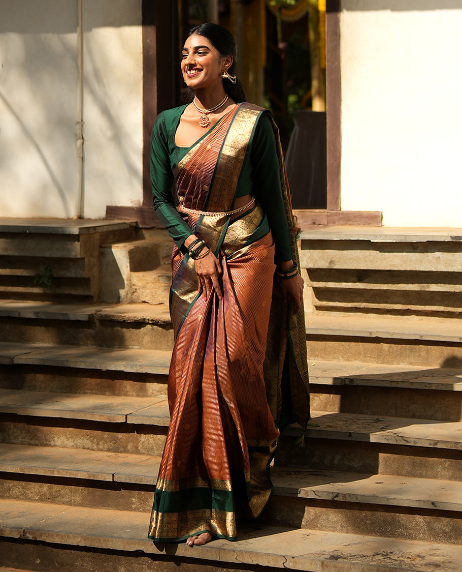 Honey-Coloured Zari Checked with Annam Chakram Buttas Vasundhara silk saree, Contrast Rettai Pettu Border of Ara Bogudi, Muthu, Banaras, Puli Nagam, Iruthalai Pakshi, and Chakram Designs, and Intricate Pallu