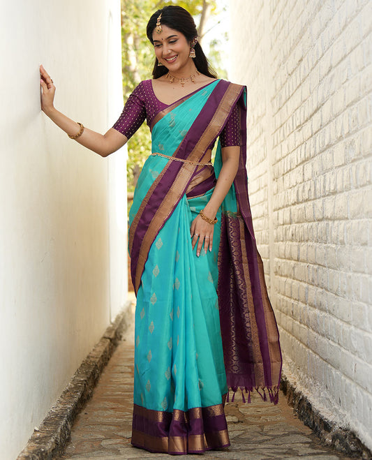 Blue zari buttas woven silk saree, contrast rettai pettu border of laddu kamalam designs, and jaal pallu